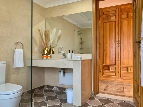 An en-suite bathroom opening off a suite