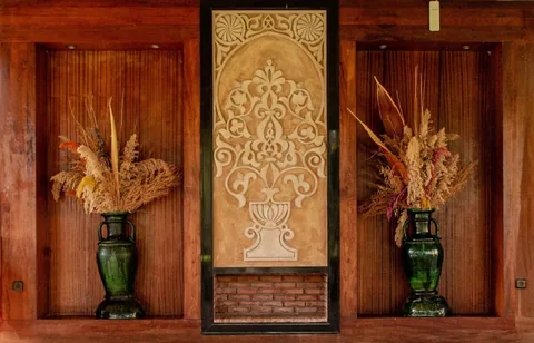 Hand-carved cedar doors with traditional plaster relief