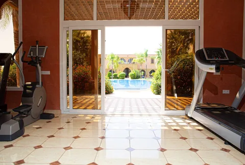 Cardio machines looking straight down the pool
