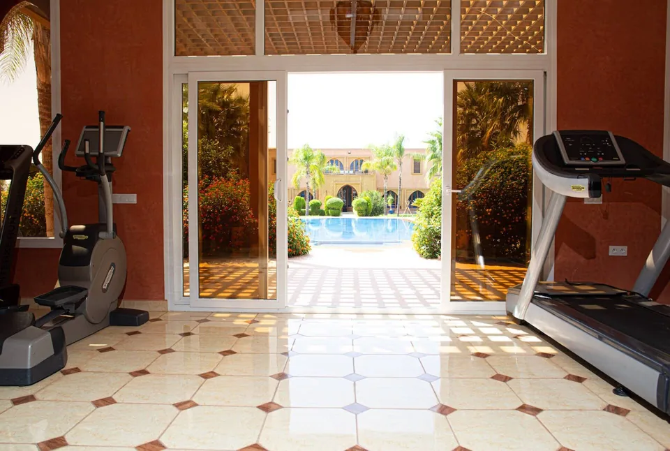 Cardio machines looking straight down the pool