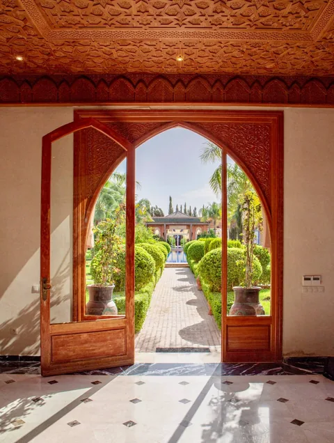 A keyhole arch framing the garden path beyond