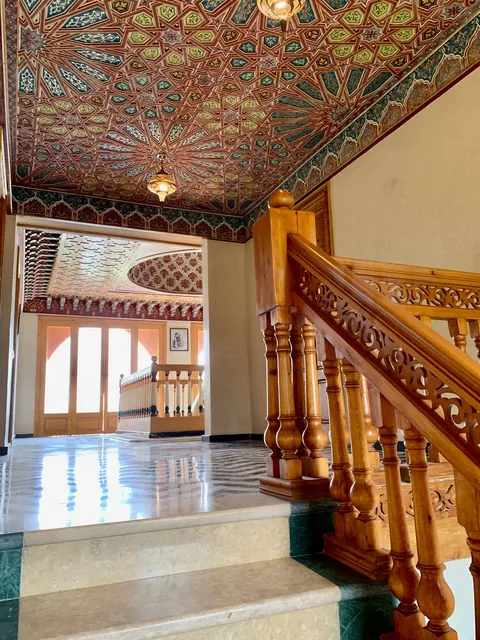The galleried landing beneath its painted dome