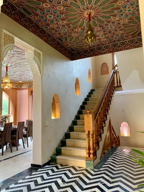 The entrance hall and staircase with zellige tilework
