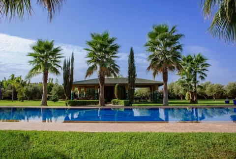 The long pool and shaded garden pavilion at Dar Alameria