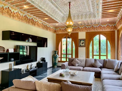 The European salon with cedar ceiling and garden-facing arches