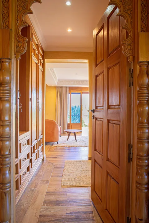 The cedar-doored corridor linking the suites