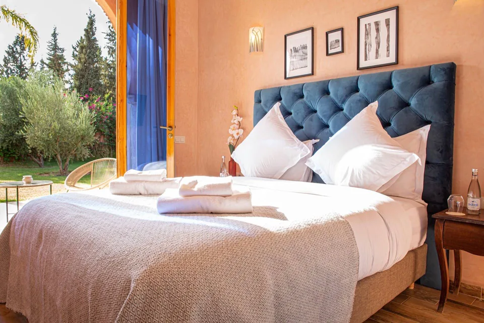 A navy-headboard suite overlooking the gardens