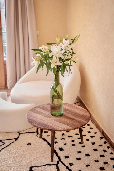 A seating nook with lilies on a graphic floor