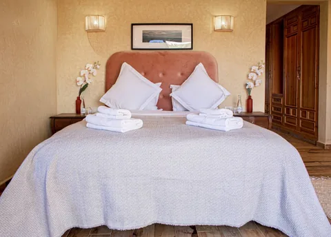 The rose suite with cedar wardrobes and white linen