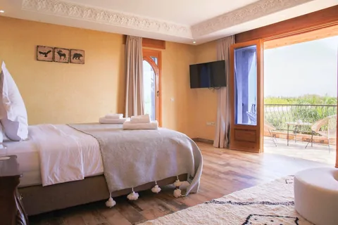 A bright suite with terrace doors and mountain views