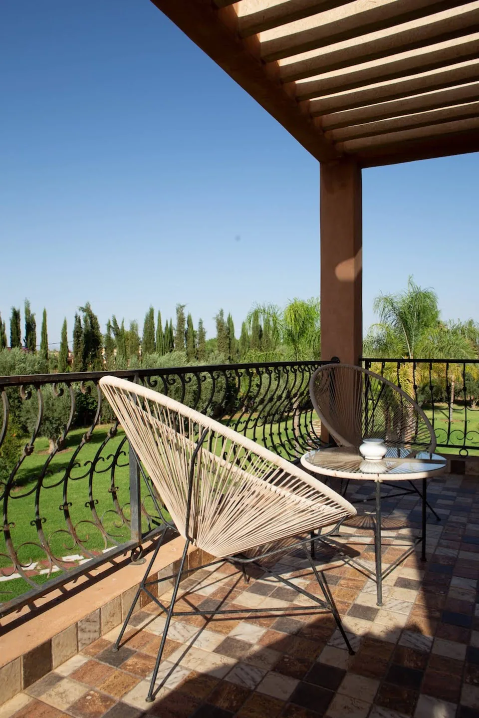 A private terrace looking over cypresses and olive trees